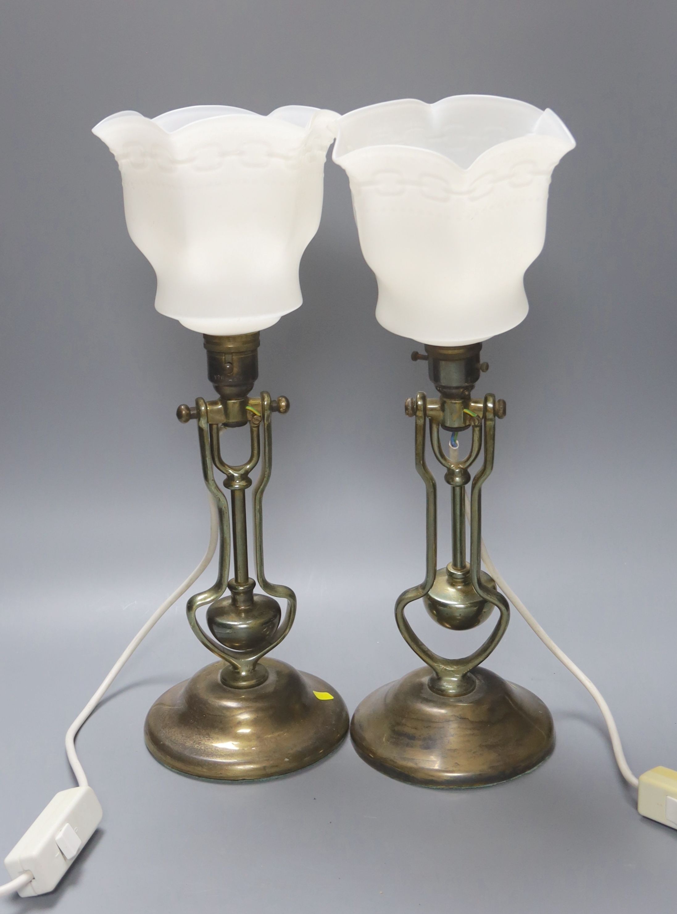 A pair of brass gimbaled ship's lamps